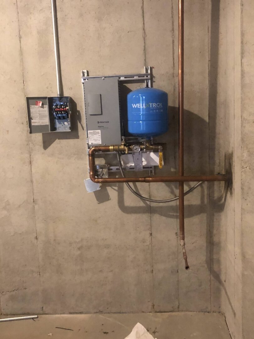 A pressure tank system set up in the basement